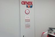 Вывеска для ANEX Tour — вид внутри офиса